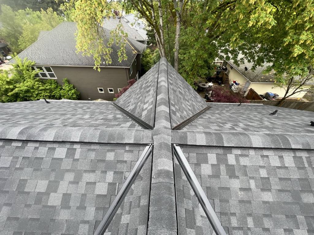 Homeowner comparing itemized roofing quotes side by side before hiring a Portland roofing contractor