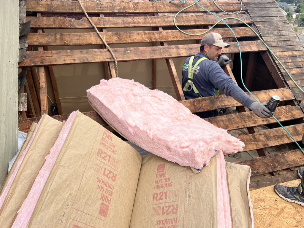 Evolution RoofWorks professional installing CertainTeed shingles in Portland neighborhood
