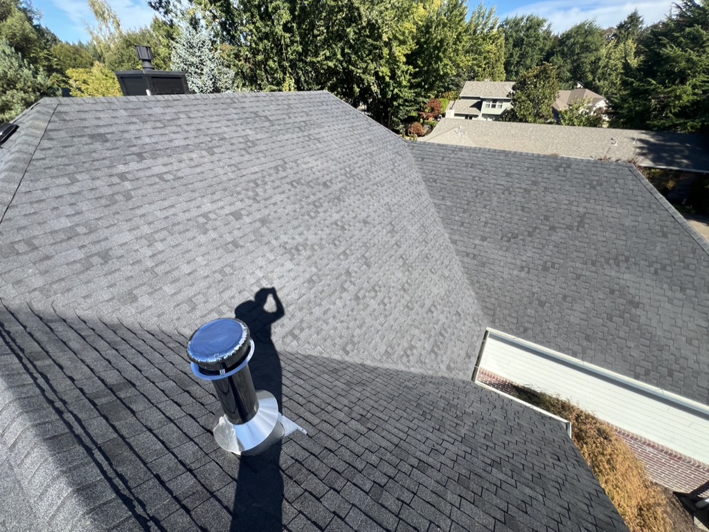 Evolution RoofWorks owner Sean O'Hare conducting a physical roof inspection in Portland, OR