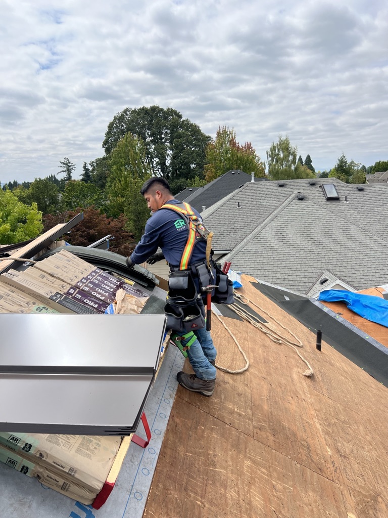Evolution RoofWorks professional roofer with safety harness on job site