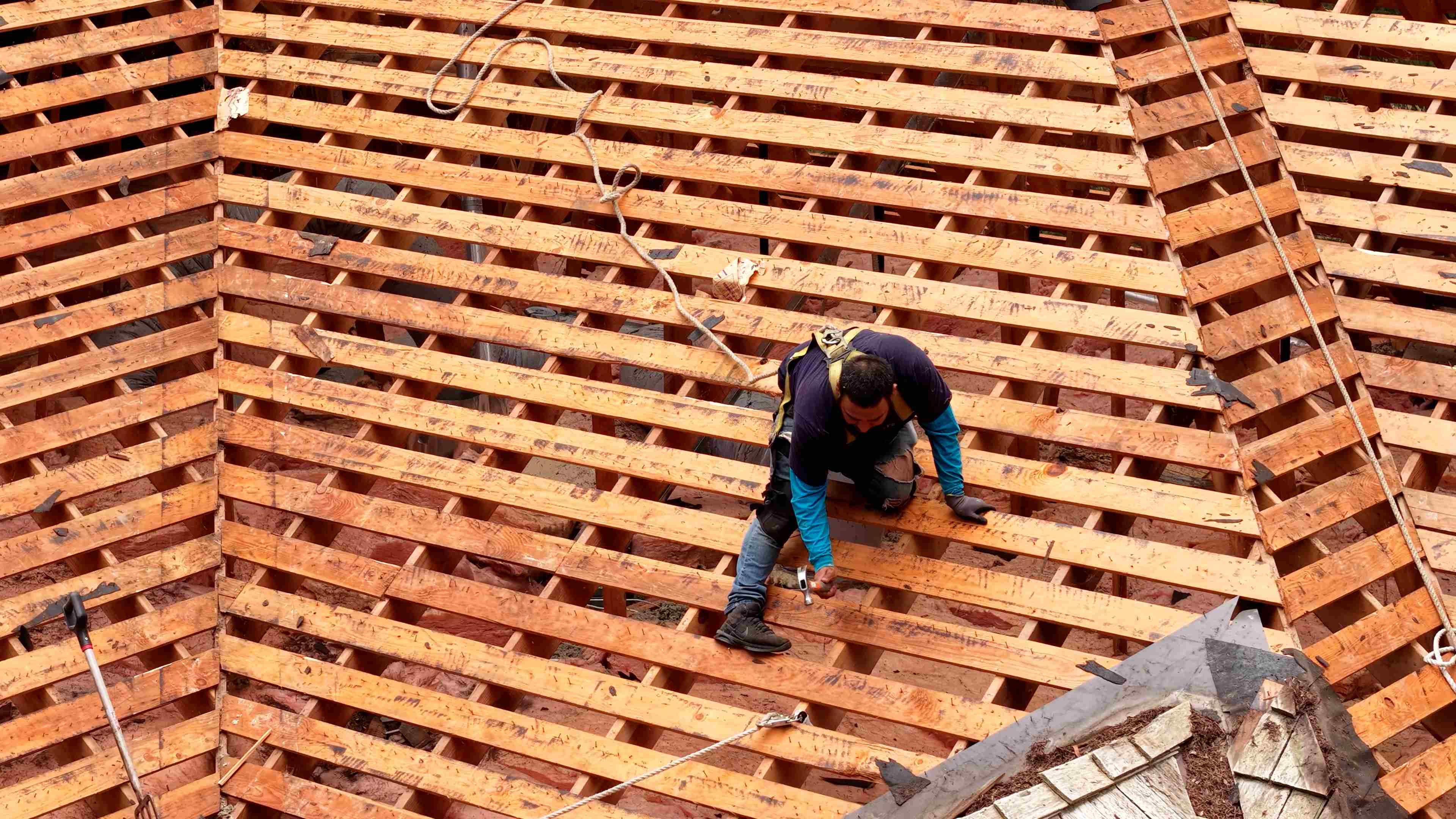 View from inside an attic showing roof decking and rafters — common inspection point for ventilation issues
