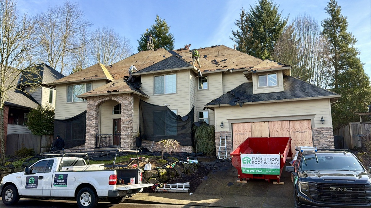 How to identify red flags when hiring a roofing contractor in Portland, Oregon — an Evolution RoofWorks crew tearing off an existing roof